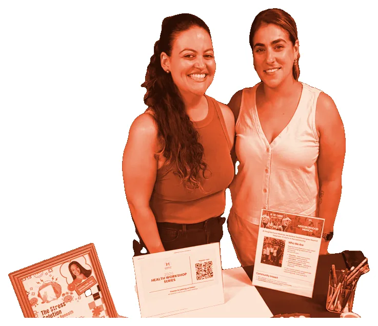 Two women hosting a Neighborhood Medical table