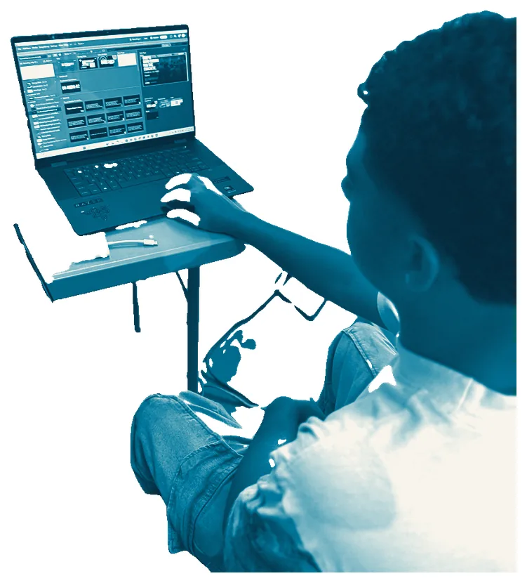 A young volunteer running slides on a laptop
