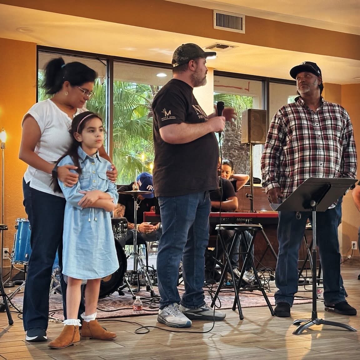 A Jesus + Recovery gathering, with neighbors sharing up front